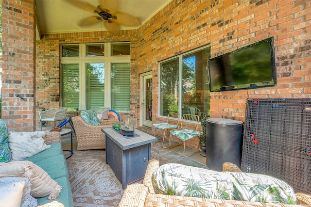 view of patio with outdoor lounge area and ceiling fan