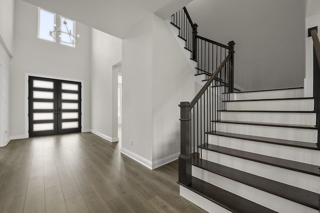 4707 Arbor Park Dr, Manvel, TX 77583 - foyer with stairs, wood finished floors, baseboards, a high ceiling, and a chandelier