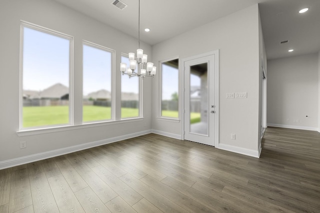 4707 Arbor Park Dr, Manvel, TX 77583 - unfurnished dining area with a chandelier, baseboards, dark wood finished floors, and recessed lighting
