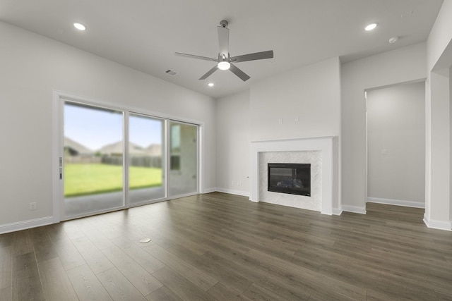 4707 Arbor Park Dr, Manvel, TX 77583 - unfurnished living room featuring ceiling fan, dark wood finished floors, a premium fireplace, recessed lighting, and baseboards