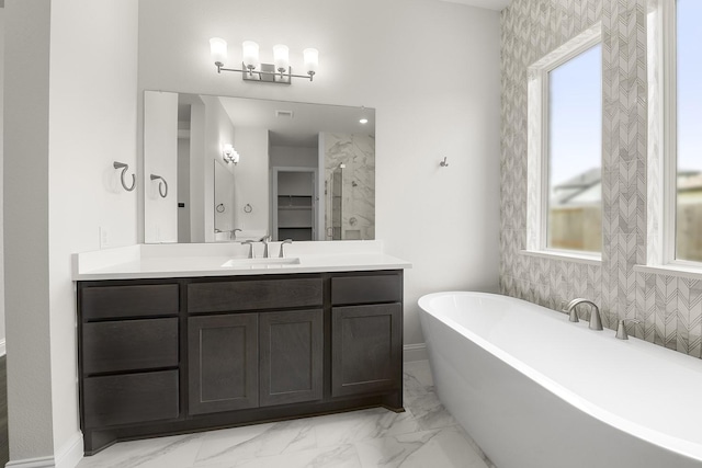 4707 Arbor Park Dr, Manvel, TX 77583 - bathroom featuring healthy amount of natural light, a freestanding tub, vanity, and marble finish floors