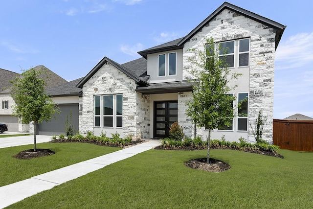 4707 Arbor Park Dr, Manvel, TX 77583 - view of front of home with stone siding, an attached garage, concrete driveway, and roof with shingles