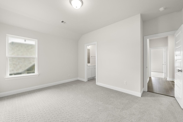4707 Arbor Park Dr, Manvel, TX 77583 - unfurnished bedroom with light colored carpet, baseboards, and connected bathroom