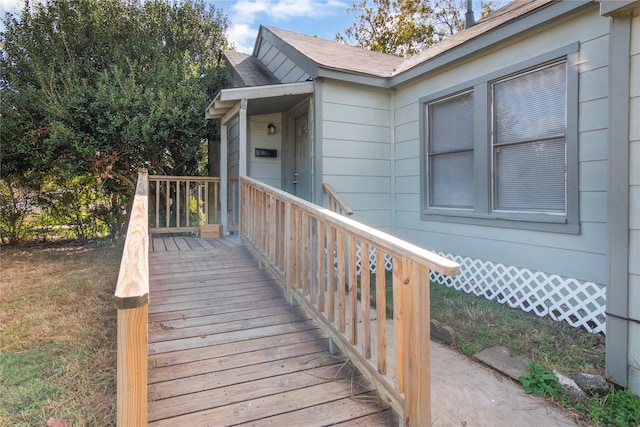 property entrance with a wooden deck