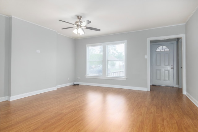 interior space with light hardwood / wood-style flooring, ceiling fan, and crown molding