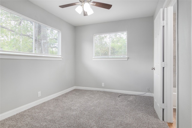 unfurnished bedroom featuring ceiling fan and carpet floors