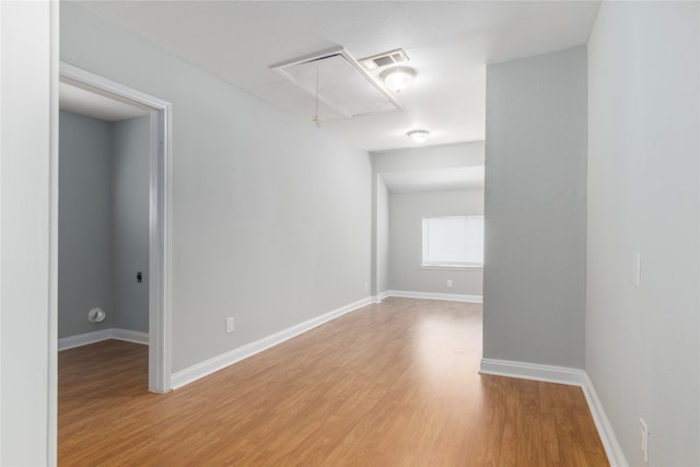 unfurnished room featuring hardwood / wood-style flooring