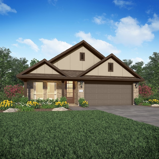 view of front of property featuring a front yard and a garage