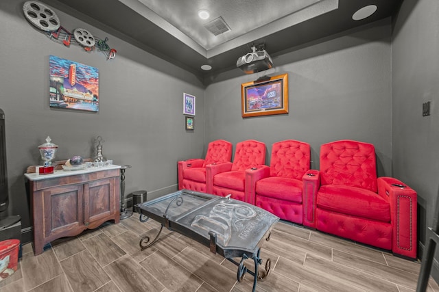 home theater room with light hardwood / wood-style flooring