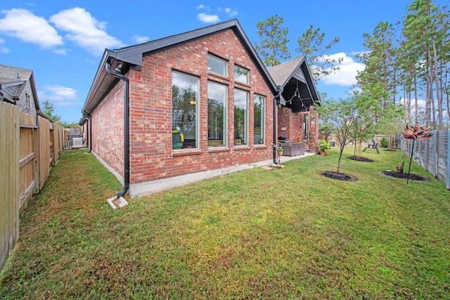 rear view of property featuring a lawn