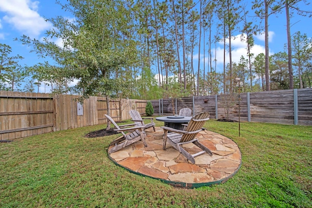 view of yard featuring a patio and an outdoor fire pit