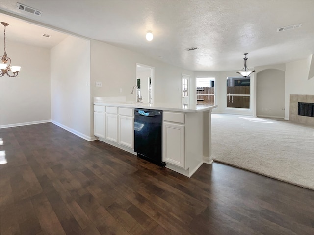 kitchen featuring white cabinetry, black dishwasher, dark hardwood / wood-style floors, and hanging light fixtures