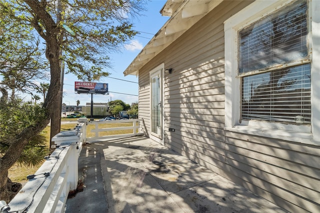 view of property exterior with a patio area