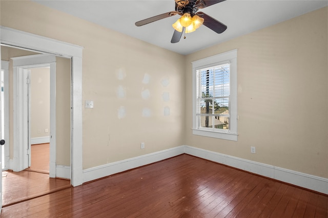 spare room with hardwood / wood-style floors and ceiling fan