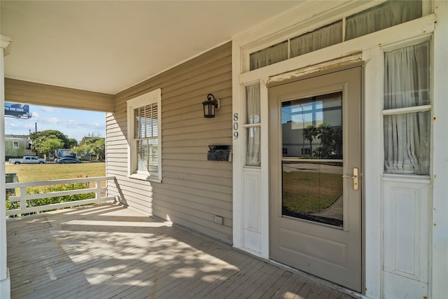 wooden deck featuring covered porch