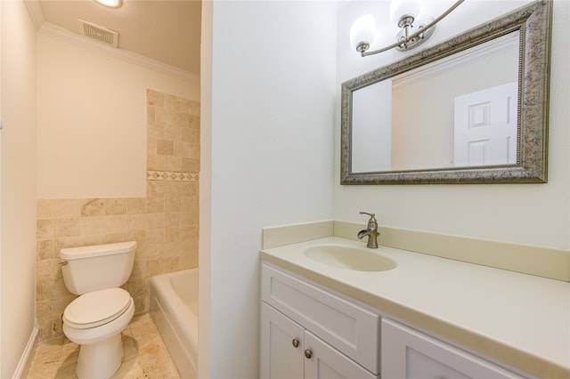 bathroom featuring vanity, toilet, crown molding, and tile walls