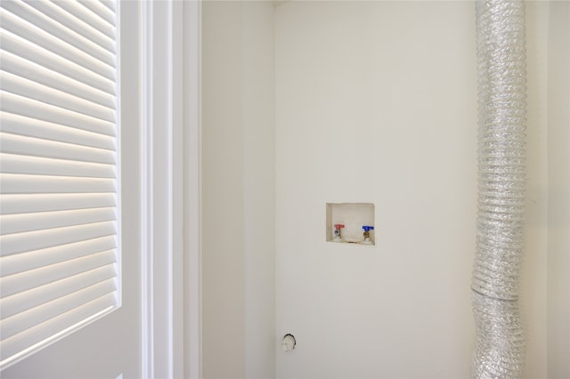 laundry room featuring hookup for a washing machine and radiator heating unit