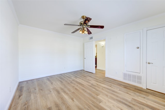 unfurnished bedroom with ornamental molding, light hardwood / wood-style floors, and ceiling fan