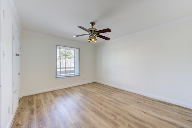 empty room featuring crown molding, light wood-type flooring, and ceiling fan