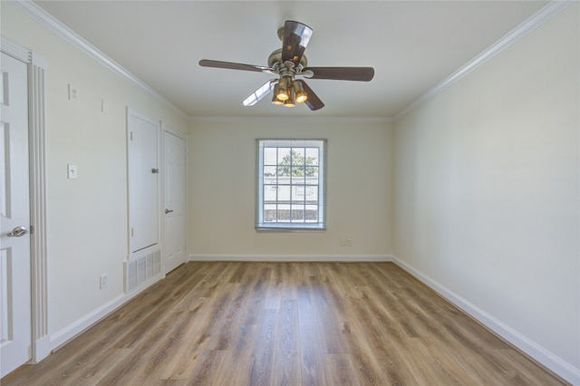 spare room with ceiling fan, ornamental molding, and light hardwood / wood-style flooring