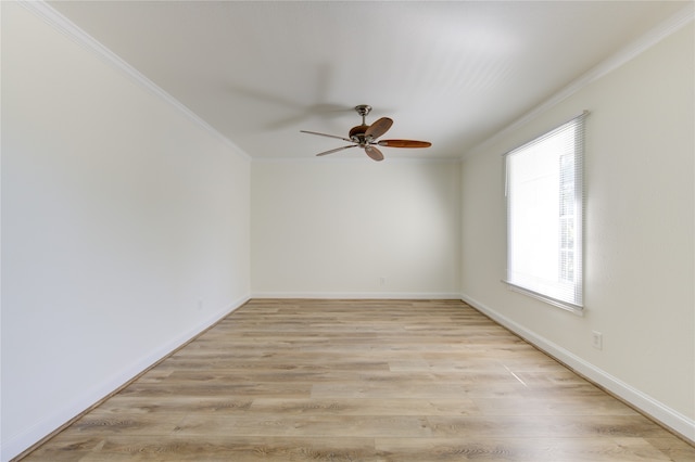 spare room featuring ornamental molding, light hardwood / wood-style flooring, and ceiling fan