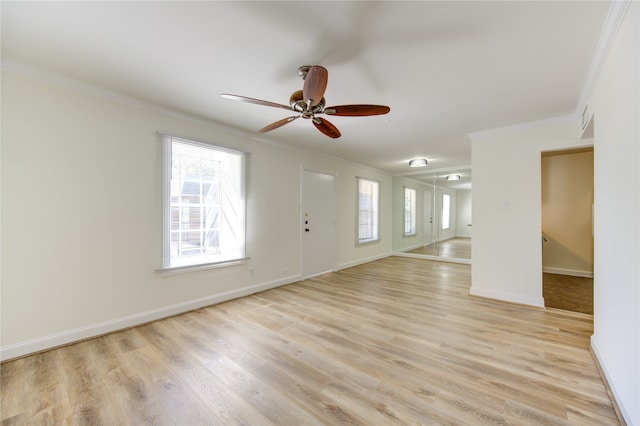 spare room with light hardwood / wood-style floors, ornamental molding, and ceiling fan