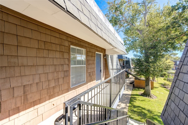 view of side of home with a yard