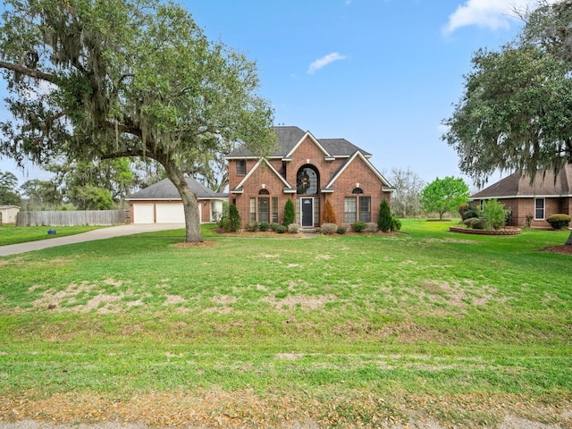 view of front property featuring a front yard and a garage