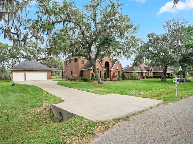 view of front of home featuring a front lawn and a garage