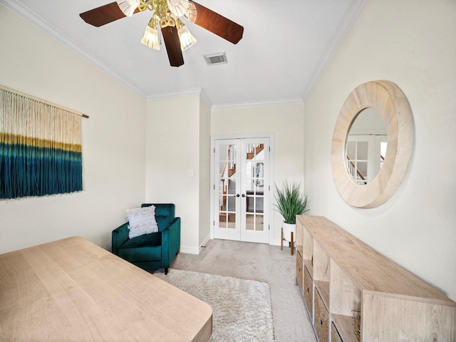 bedroom with french doors, light colored carpet, crown molding, and ceiling fan