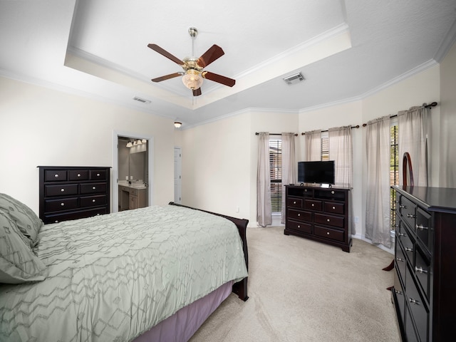 bedroom with crown molding, ceiling fan, light colored carpet, and a raised ceiling