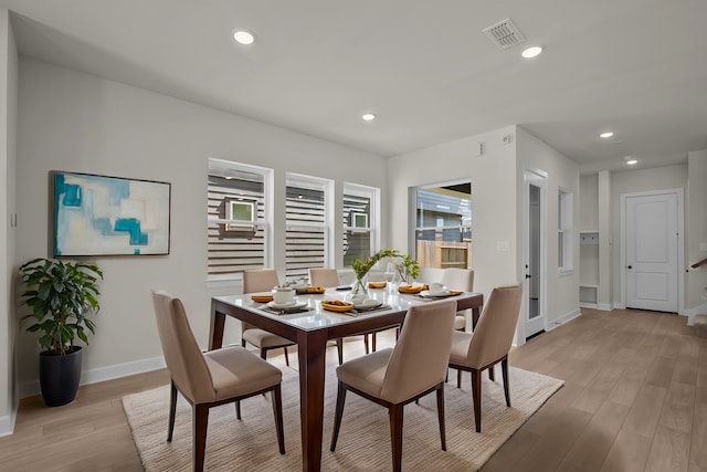 dining area with light wood finished floors, visible vents, recessed lighting, and baseboards