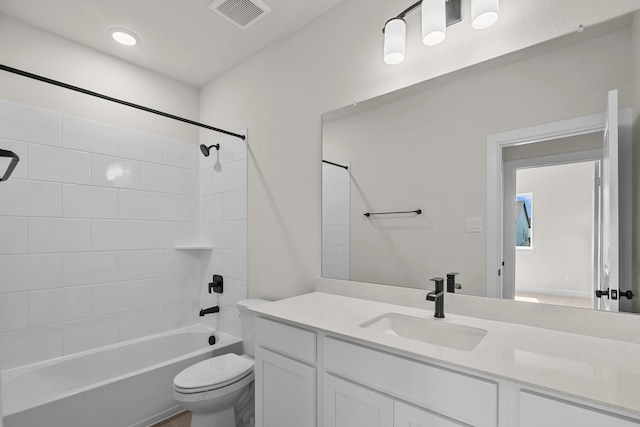 full bath featuring visible vents, toilet, vanity, and bathtub / shower combination