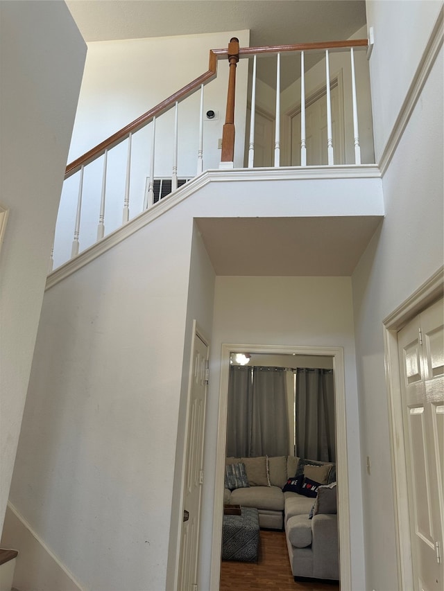 stairs featuring hardwood / wood-style floors