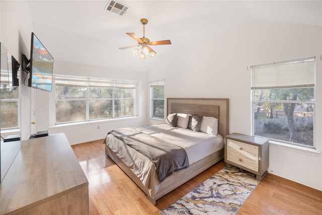 bedroom with lofted ceiling, light wood-type flooring, and ceiling fan