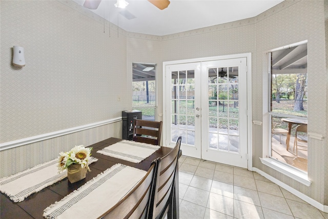 dining room with french doors, ceiling fan, and light tile patterned floors