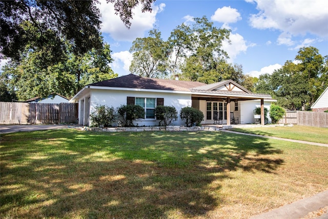 ranch-style home with a front yard