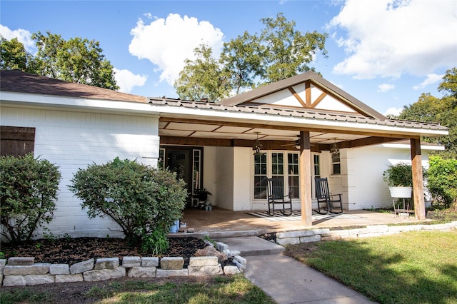 exterior space featuring a patio area, a lawn, and ceiling fan