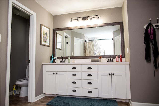 bathroom featuring toilet, vanity, hardwood / wood-style floors, and a shower with shower curtain