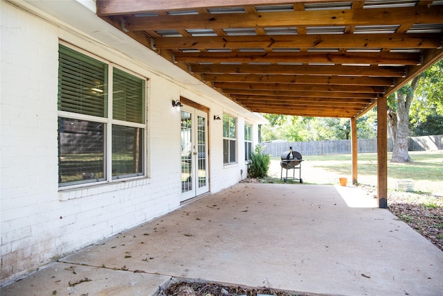 view of patio / terrace with a grill and a pergola