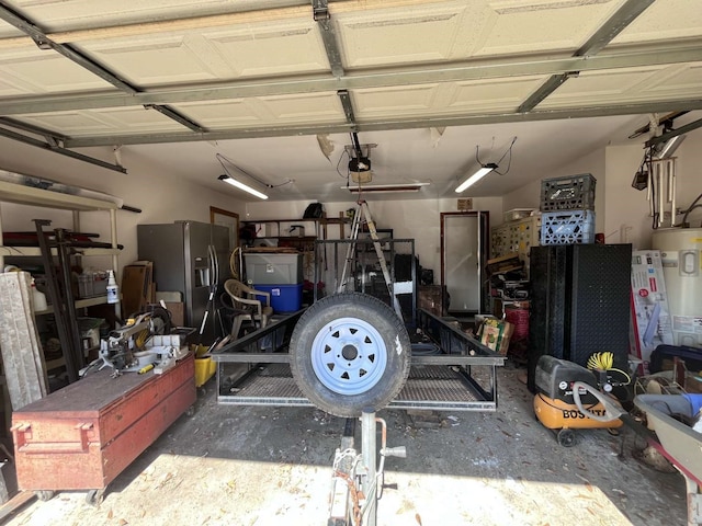 garage with a garage door opener, electric water heater, and stainless steel fridge with ice dispenser