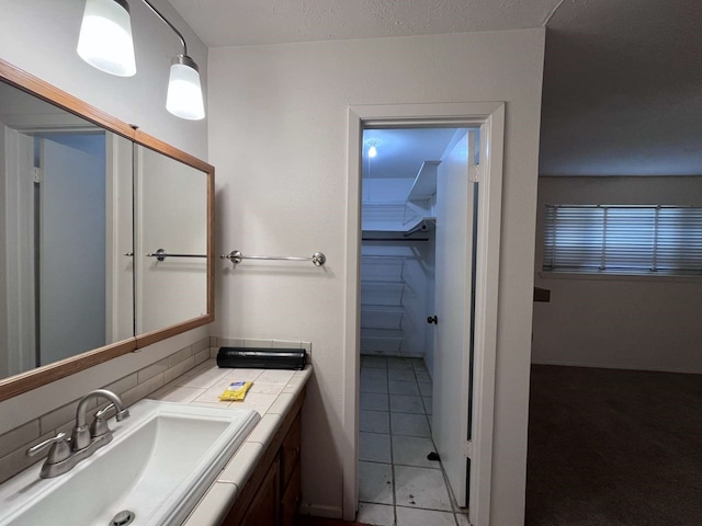 bathroom featuring vanity and tile patterned flooring