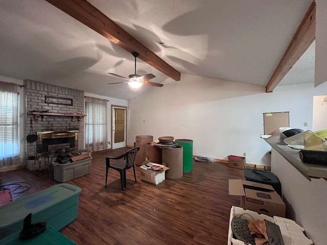 living room featuring dark hardwood / wood-style floors, a healthy amount of sunlight, and ceiling fan