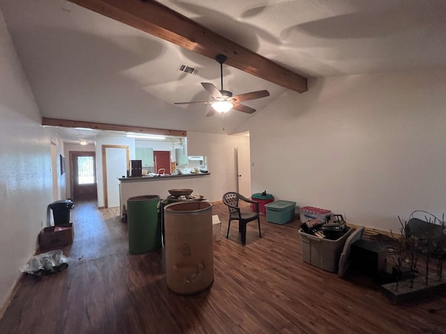 interior space with ceiling fan, lofted ceiling with beams, and dark hardwood / wood-style floors