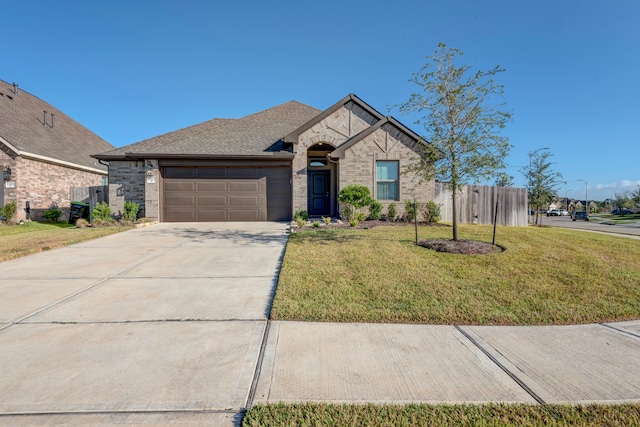 view of front facade featuring a front lawn and a garage