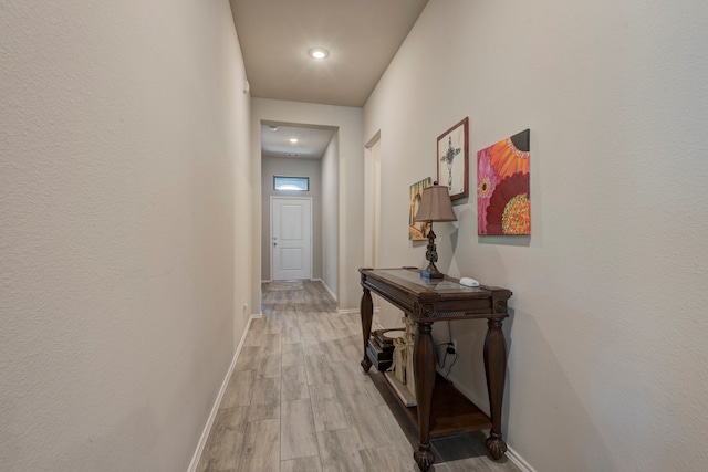 corridor featuring light hardwood / wood-style flooring