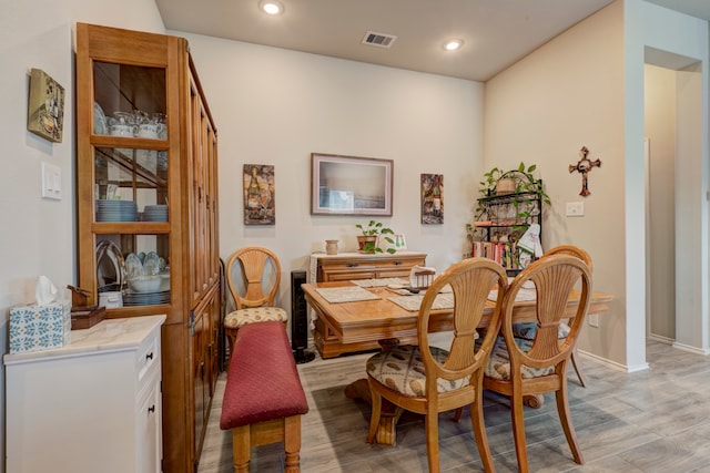 dining area with light hardwood / wood-style floors