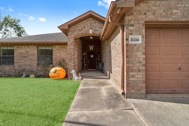 entrance to property with a yard