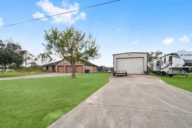 view of front of home with a front yard and a garage