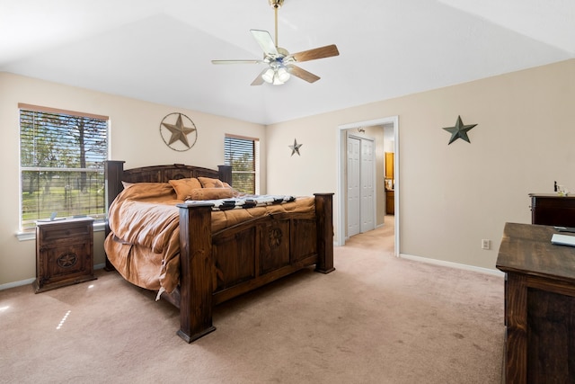 carpeted bedroom featuring ceiling fan and vaulted ceiling